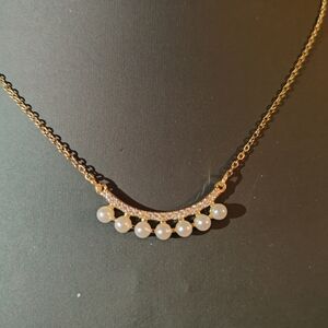 Elegant Gold and White Necklace